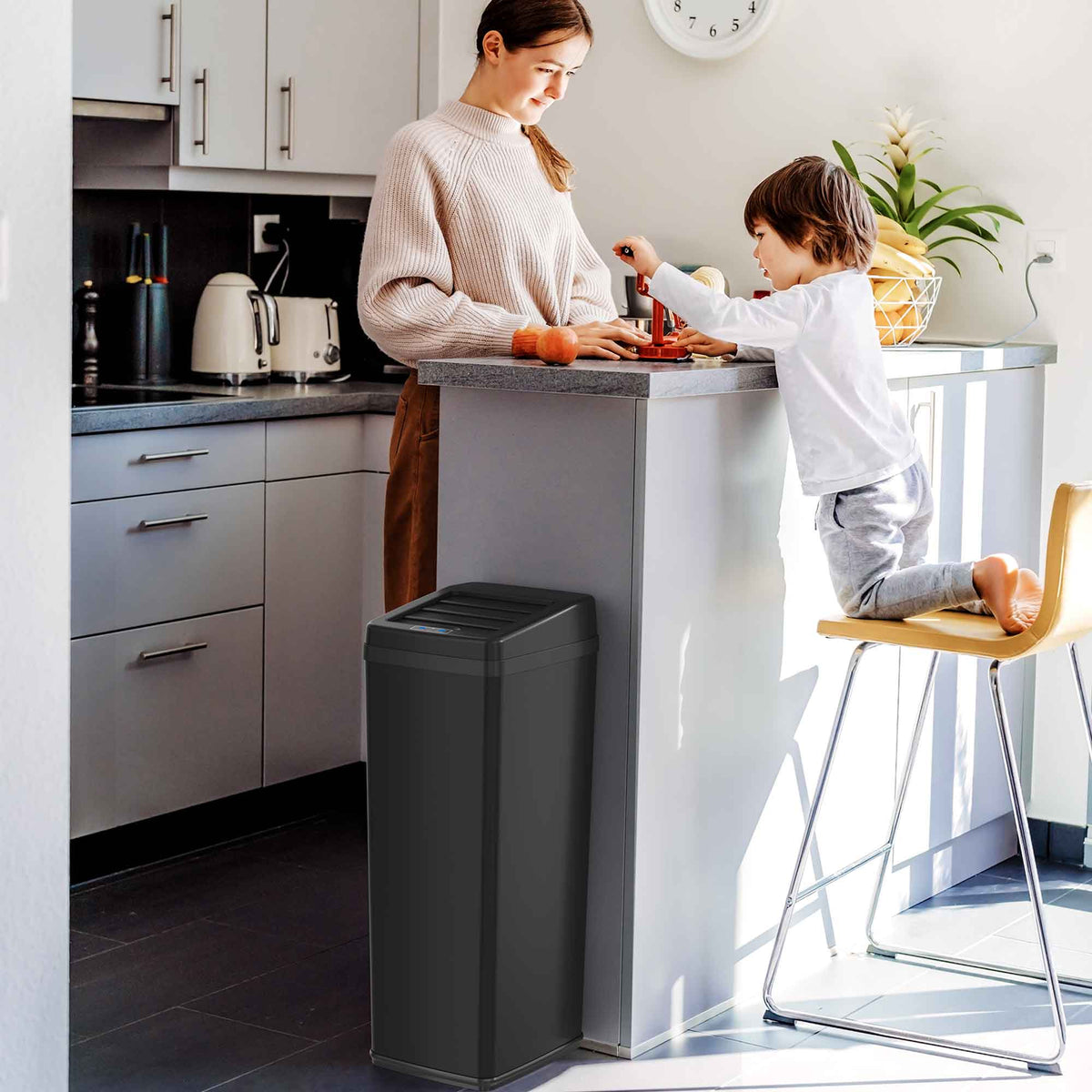 14 Gallon Black Stainless Steel Sliding Lid Sensor Trash Can with Odor Filter in kitchen