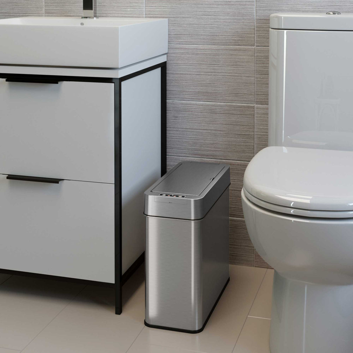 4 Gallon Stainless Steel Slim Sensor Trash Can (Left Side Lid Open) in bathroom