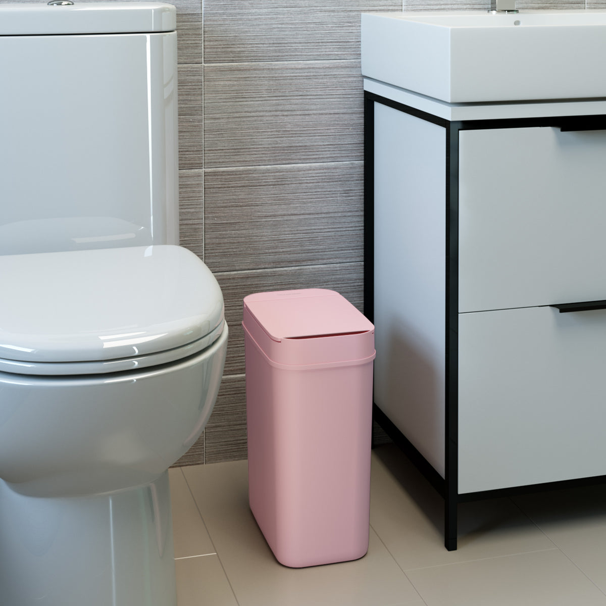 3 Gallon / 10 Liter Plastic Sensor Trash Can (Pink) in bathroom